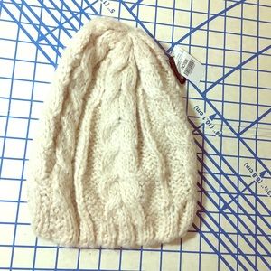 Cream colored acrylic NWT knit hat from wet seal